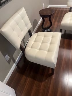 Two accent chairs and small table.