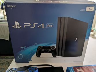1TB PlayStation 4 Pro, 2 controllers, many games in original box!