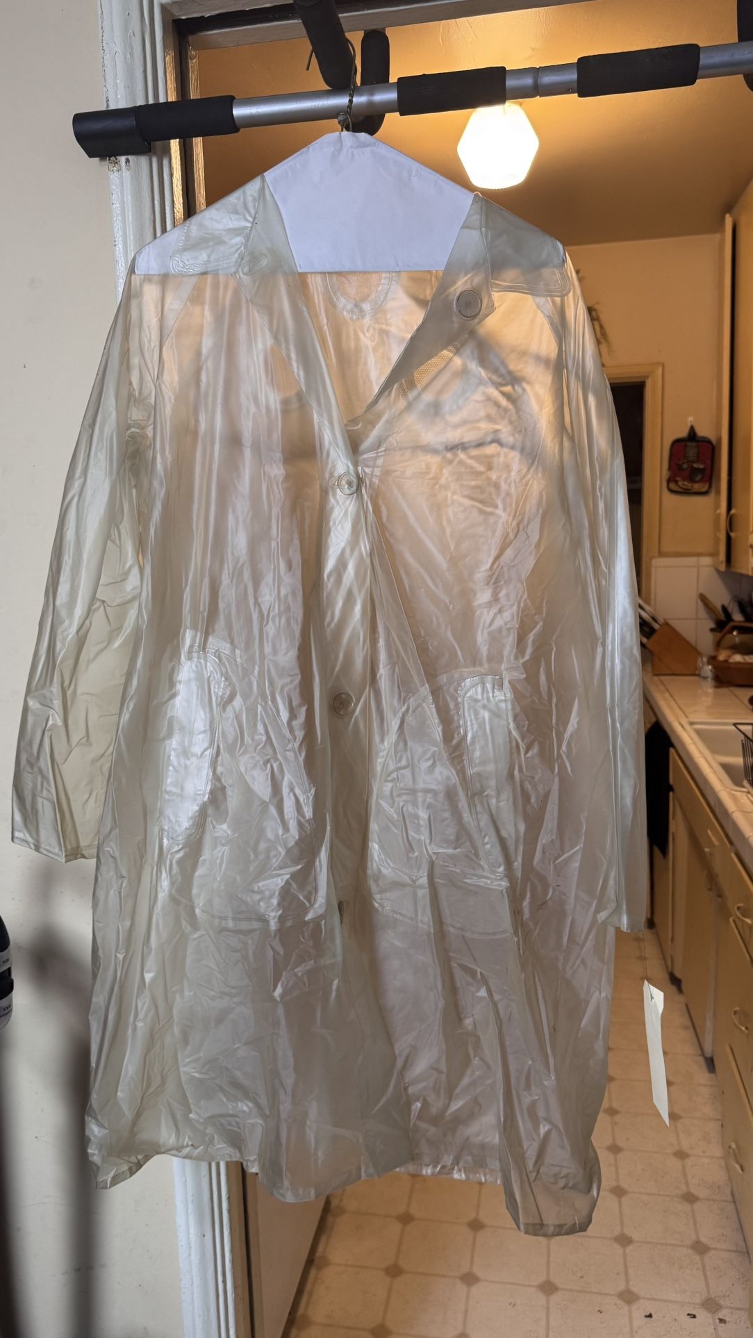 Clear Waterproof Raincoat with Snap Closure 1970