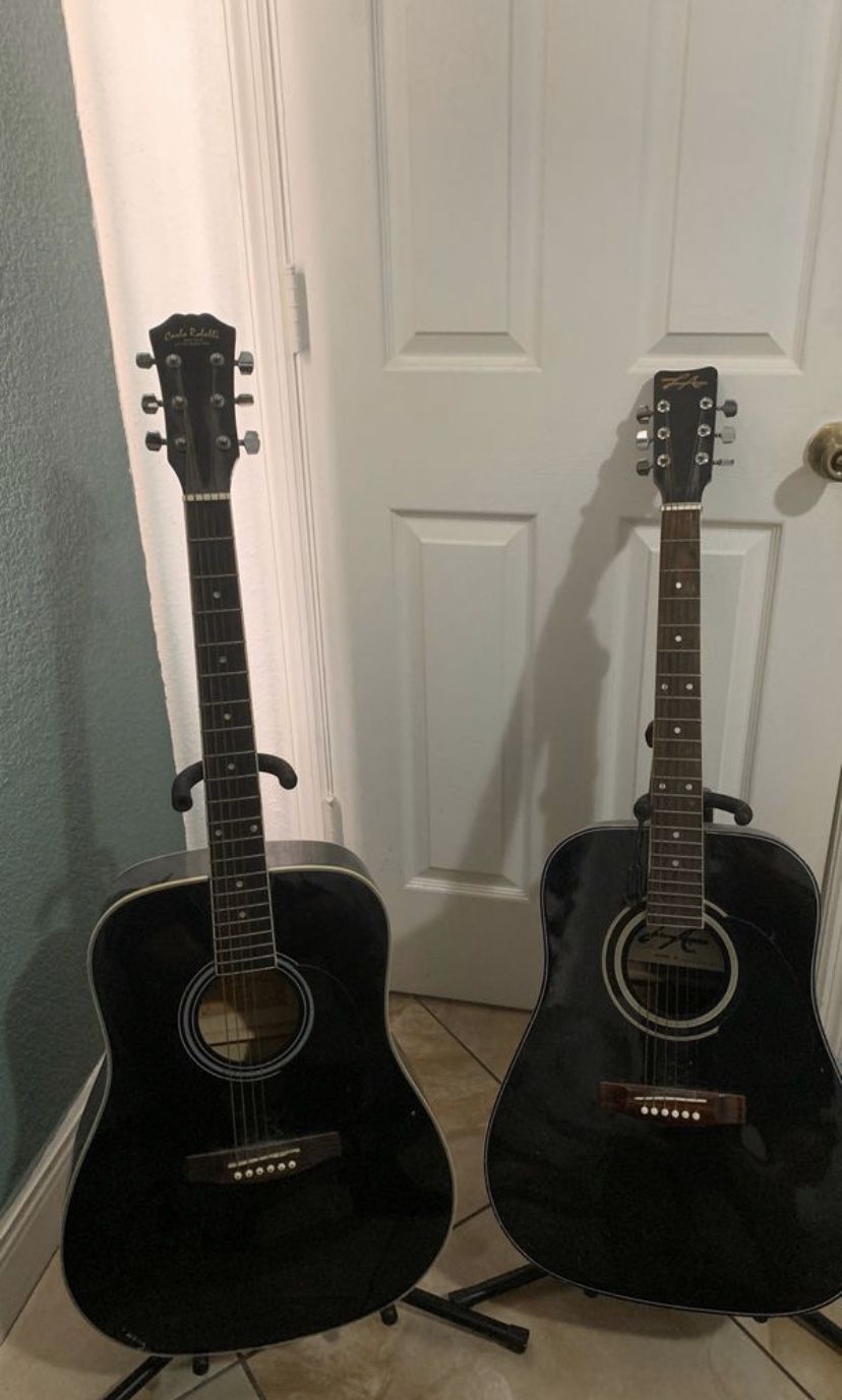 2 Black Acoustic Guitars