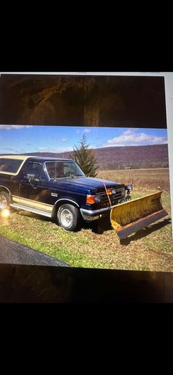 7 foot snow, plow blade, hydraulic lift with controls.