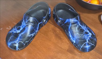 Crocs Bistro Graphic Clogs featuring a black base with a blue lightning bolt pattern.