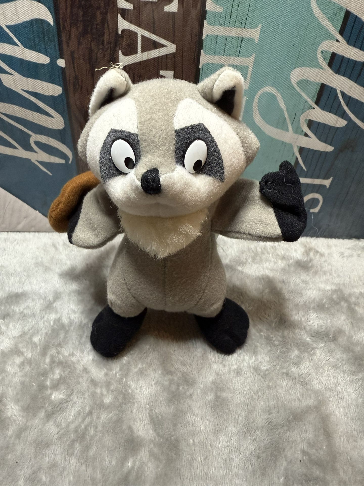 Disney Pocahontas Meeko Raccoon plush toy.
