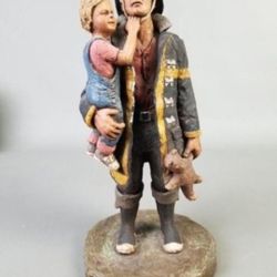 Michael Garman Sculpture – Firefighter Holding Child, Black and Yellow