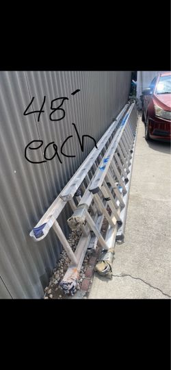 Excelente condition 48 feet and more sizes available aluminum extension, Ladders