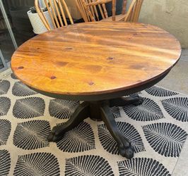 Round solid wood dining table