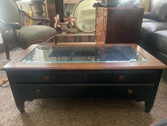 Glass top coffee table with drawers