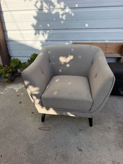 Cushioned chair sofa