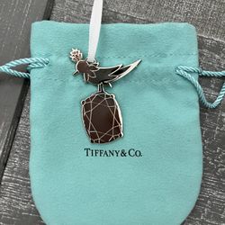 Authentic Tiffany & Co bird on the rock charm with a pouch