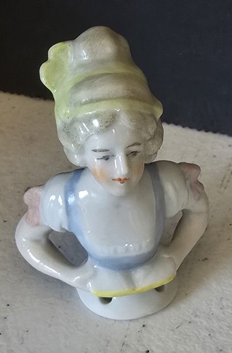 VTG 2.5" half doll / pincushion doll. Blue/white dress, Holding a book