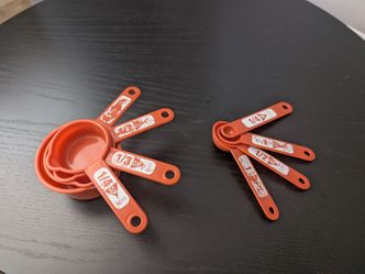 Orange Plastic Measuring Cups and Spoons Set