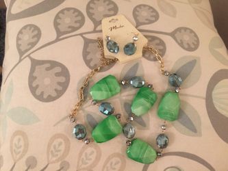 Brand new earring and long necklace set.