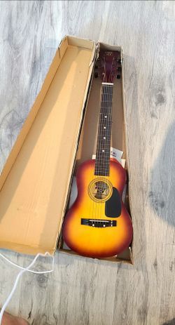 GUITAR . First Act Student Youth Guitar. Still in original box. Bought for my son but he never used it. Has all original booklets, including the Learn