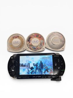 PSP 1000 with charger + 4 games