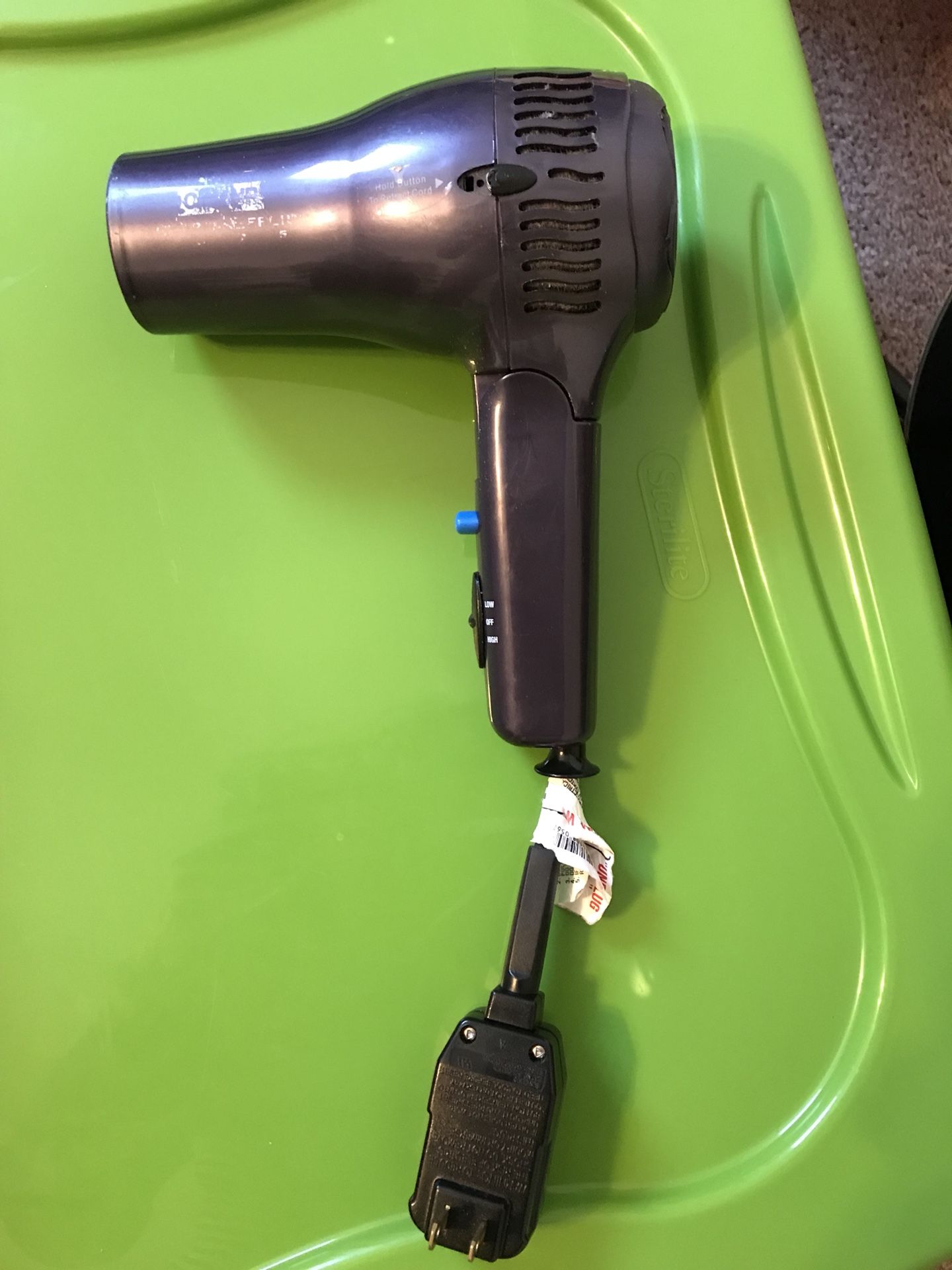 Hair dryer with retractable cord
