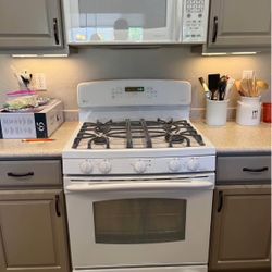 White kitchen appliances set with gas range