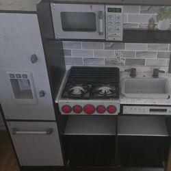 KidKraft Uptown Elite Espresso Play Kitchen Lights and Sounds, Working Ice Maker and Click and Turn Knob