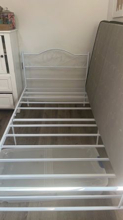 Twin White wrought iron bed with mattress (like new)