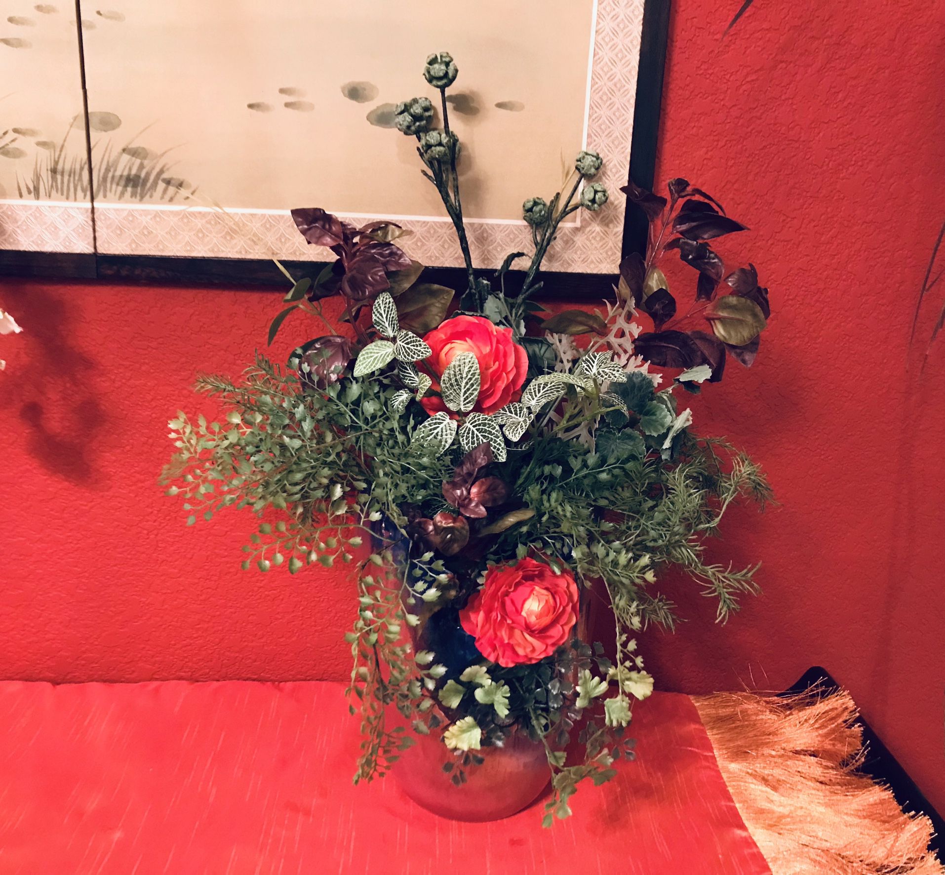 Faux silk floral arrangement in a beautiful uneven edge vase