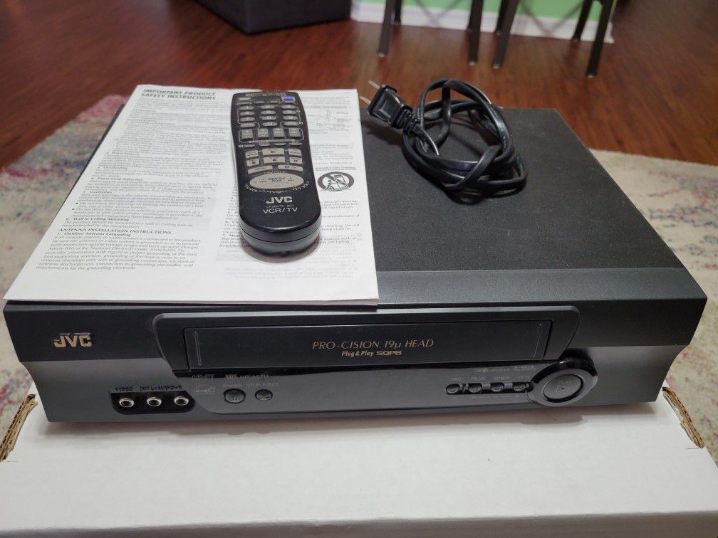 JVC HR-A57U VCR & 26 VHS Tapes