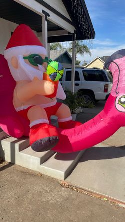 Santa With Inflatable Pool Flamingo 