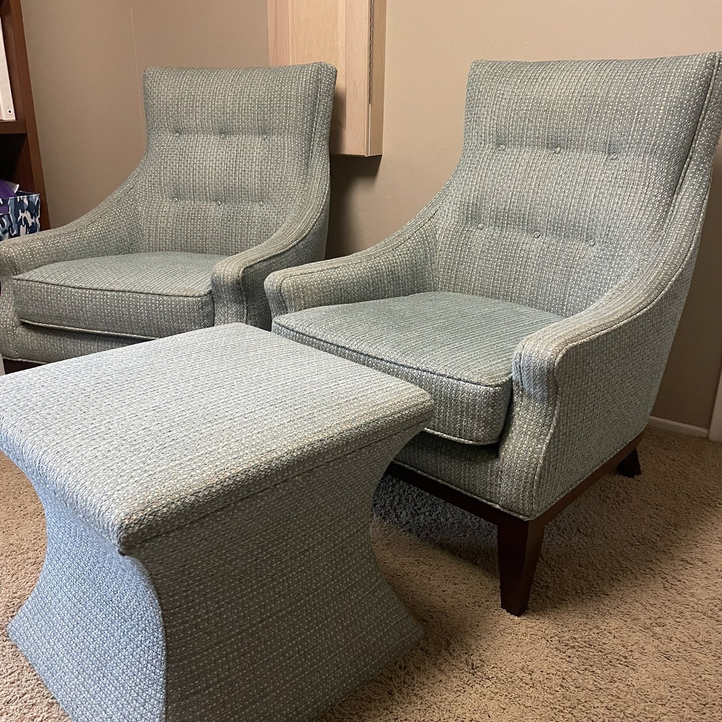 Upholstered chairs and ottoman