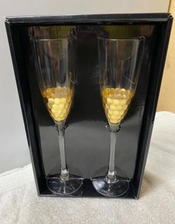 Set of (2) Gold Honeycomb Champagne Glasses with Gold  hammered bowl bottoms. Glasses feature the perfect amount of pop with its gold base. The hammer