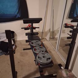 Weight bench,bar and 50lbs of weights