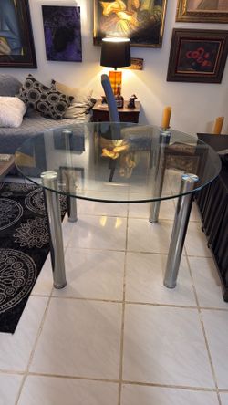 Heavy glass round table with silver round legs