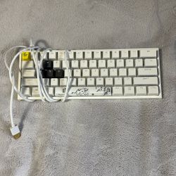 Ducky one two mini/ will give you lots of key caps
