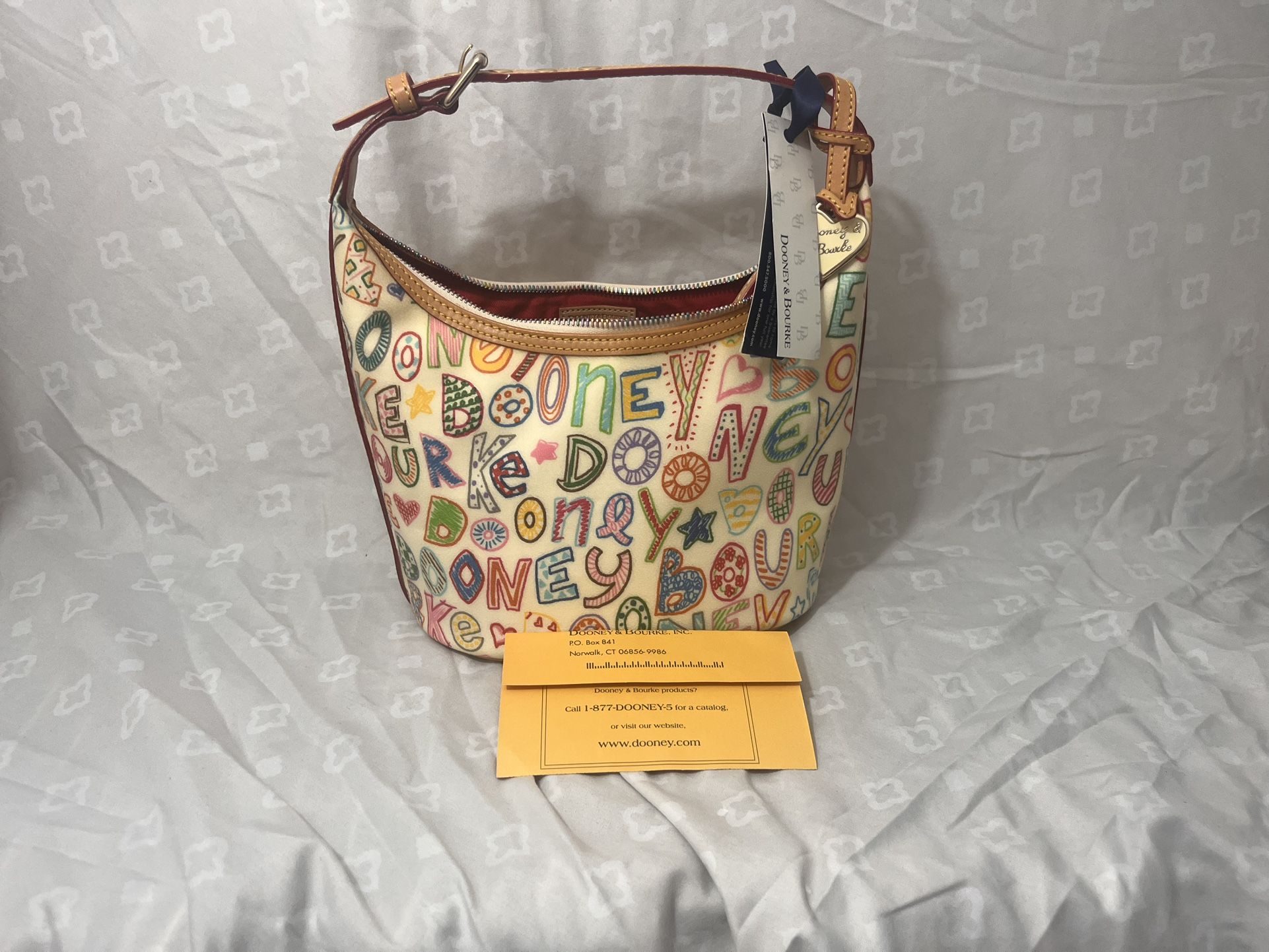 Dooney & Bourke Crayon Style Scribble Logo Multicolor Coated Canvas Hobo Bag.