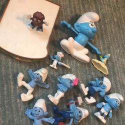 Smurf Figures and One Raisin Figure 