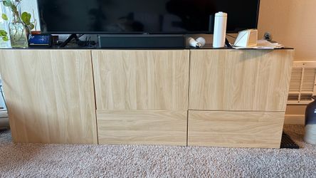 IKEA besta floor TV unit with black glass top