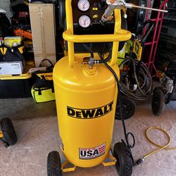 Powerful DeWALT 27 gallon air compressor. Has 200 PSI max tank pressure and 5.1 SCFM at 90 PSI. Motor is 1.7 HP. Comes with an air gun attachment and 