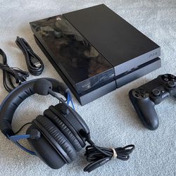 500 GB PlayStation 4 with headphones