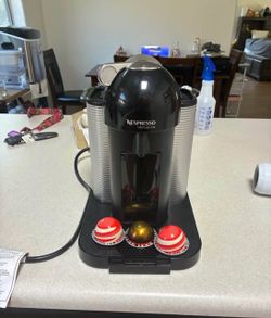 Nespresso Vertuo Line Coffee Maker with three espresso pods