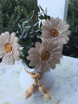 Ceramic vase with burlap flowers