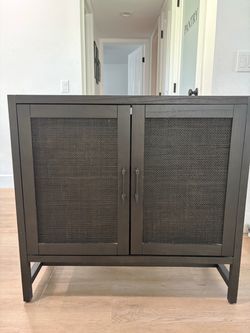 Dark Wood Cabinet with Cane Door Panels
