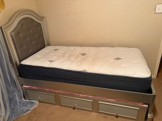Twin bed with trundle and both mattresses.  Also a matching nightstand