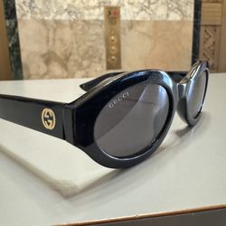 Gucci Oval Shiny Black and Gold Sunglasses