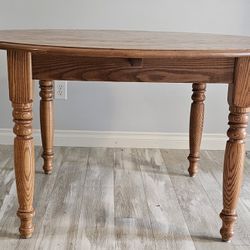 Solid Oak Table 54.5" Diameter Plus Two 12" Leaves