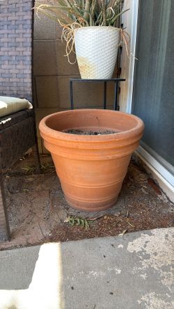 Large terracotta pot with drainage hole
