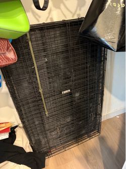 Large black metal dog crate