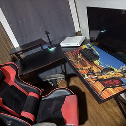 Corner desk, gaming chair, and headset stand