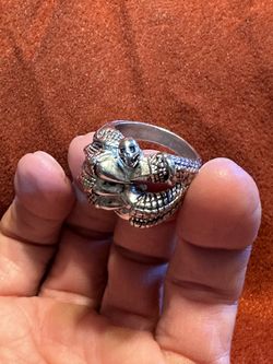 Silver claw ring with small skull