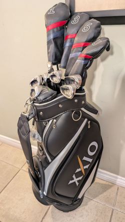 LH MINT XXIO EXPERIENCE THE DIFFERENCE DRIVER SET, AND IRON SET, BRAND NEW XXIO CADDIE'S STAFF GOLF BAG PLUS BRAND NEW MLA PRO CLASS PUTTER