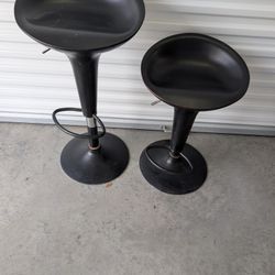 
Black Plastic Adjustable Height Swivel Barstools....some