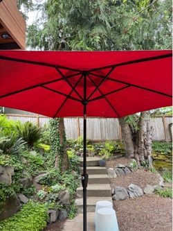 Outdoor umbrella with base