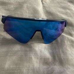 Oakley Sutro Lite shield-style sport sunglasses matte dark (navy/black) O Matter frame with a single-piece blue mirrored lens