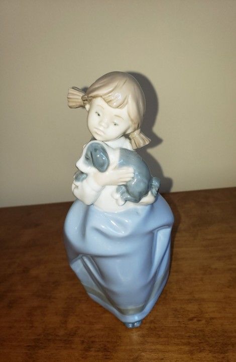 NAO by Lladro-
Girl Holding Puppy Porcelain Figurine- 
DAISA 1987